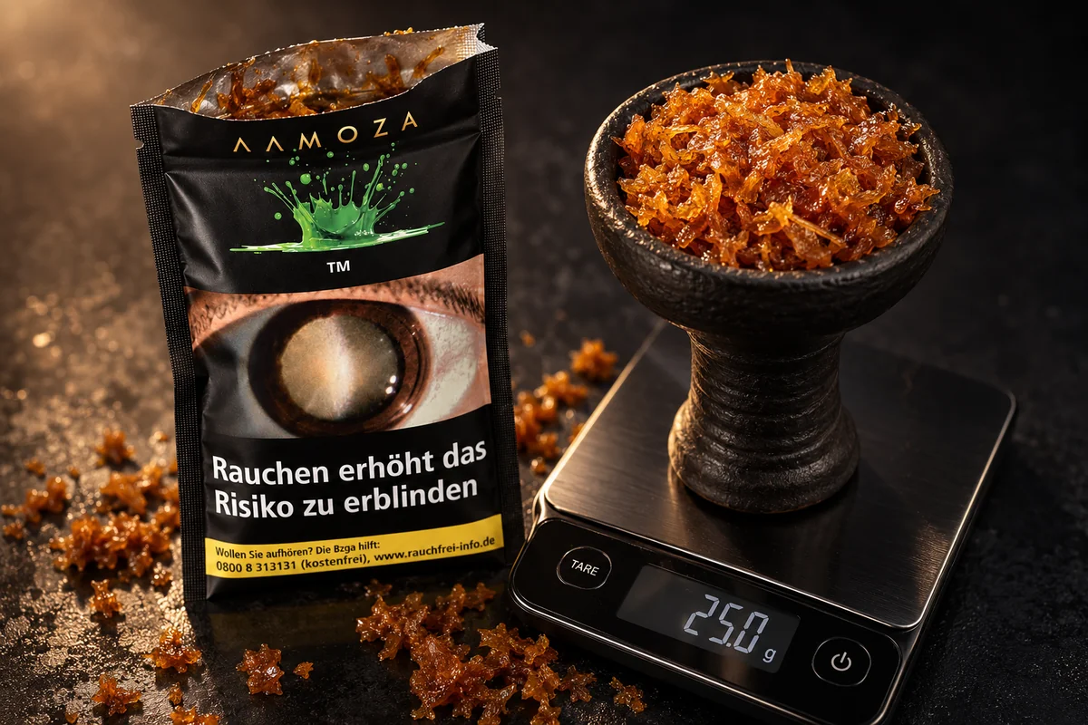 Geöffnete AAMOZA 25 g Packung neben einem gefüllten schwarzen Phunnel-Kopf auf einer Digitalwaage mit 25,0 g